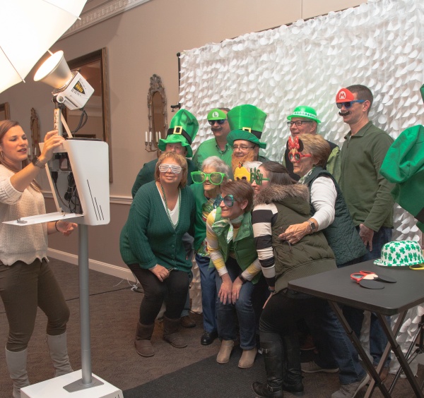 People dressed in green in the photo booth