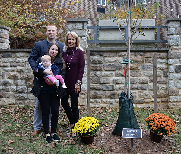 Shel and family next to the tree